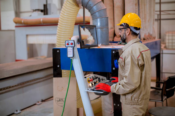istock Senior man operating machine units in modern factory standing by control panel 1186729252