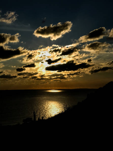 istock Looking over sea at sunset 1186729842