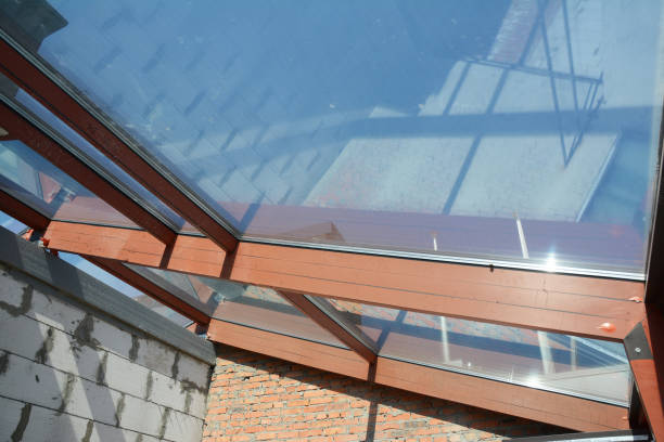 istock Conservatory roof under construction. Glass, skylight ceiling in new modern house 1186729854