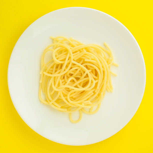 istock pasta, spaghetti or bucatini (ingredients, serving portion of food ). menu concept. food background. copy space. Top view 1186730042