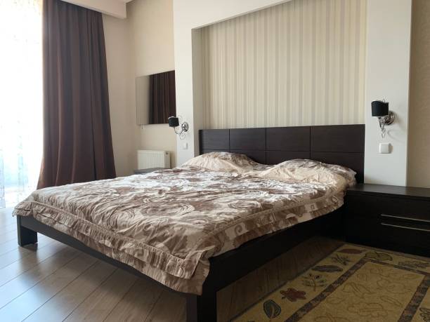 istock stylish bedroom with a bed 1186730091