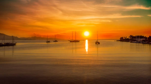istock Sailing catamaran yachts moored in Datca bay at sunset 1186730169
