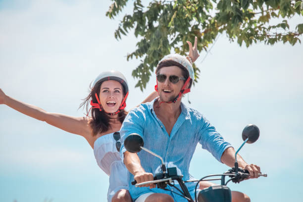 istock Happy couple on a scooter 1186733918