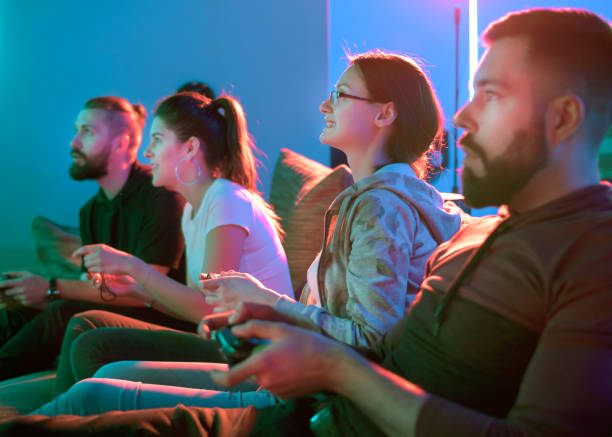 Group of friends having fun while playing video games