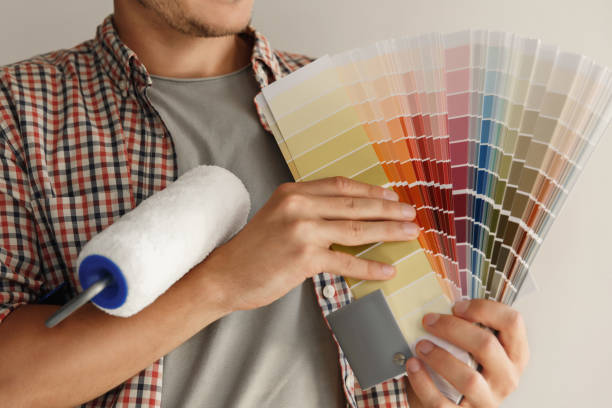 istock Painting wall. Man holding color palette 1186735828