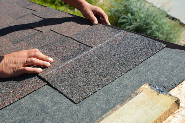 istock Asphalt Shingles Installation. Roofer Contractor Installing Asphalt Shingles on House Roofing Construction 1186737073