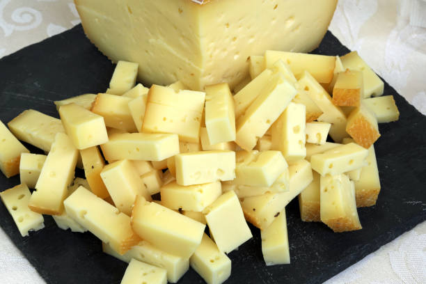 istock yellow aged cheese and the black slate 1186737273