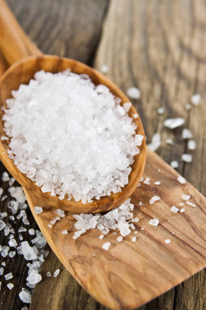 istock Salt on a wooden spoon close up 1186743309