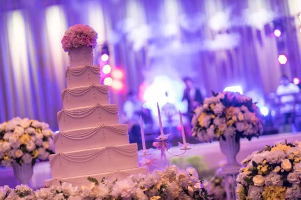 istock cake for wedding party. Beautiful wedding reception. Look from afar at luxurious restaurant hall prepared for wedding dinner. 1186743891