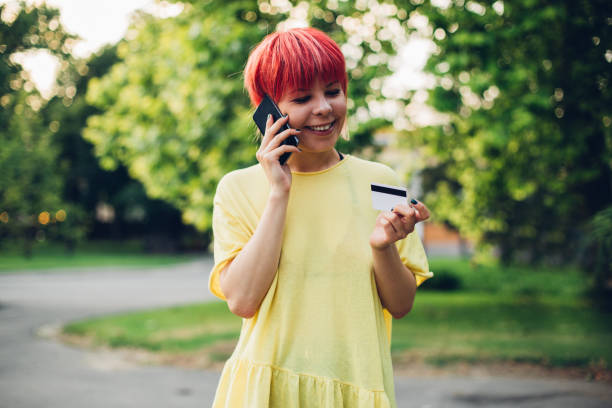 istock Cheerful girl talking in the park 1186746705