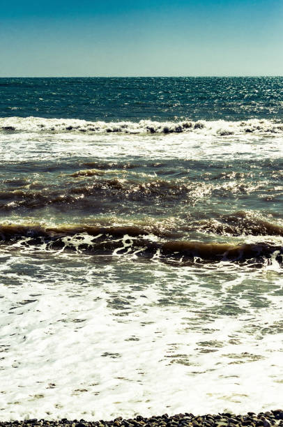 istock abstract background with waves on the sea 1186749358