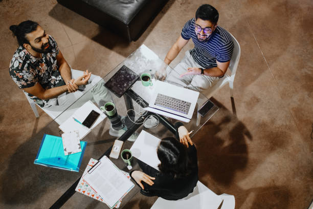 istock Group of students studying at home late at night 1186749387