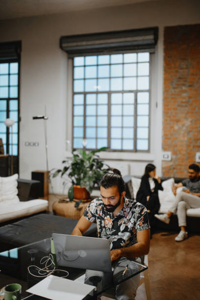 istock Young man working from home at night 1186749483