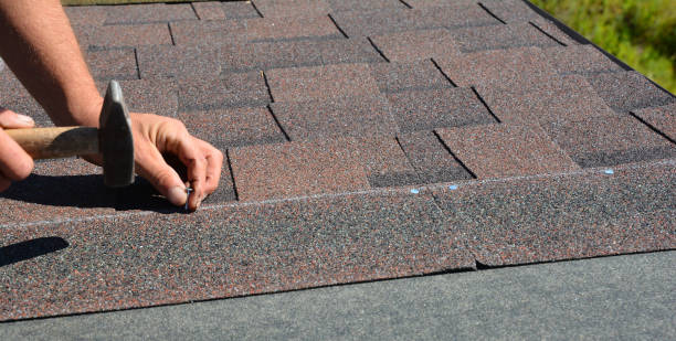 istock Roofer hands installing asphalt shingles on house construction roof corner with hammer and nails.  Roofing Construction Panorama Photo. 1186750626