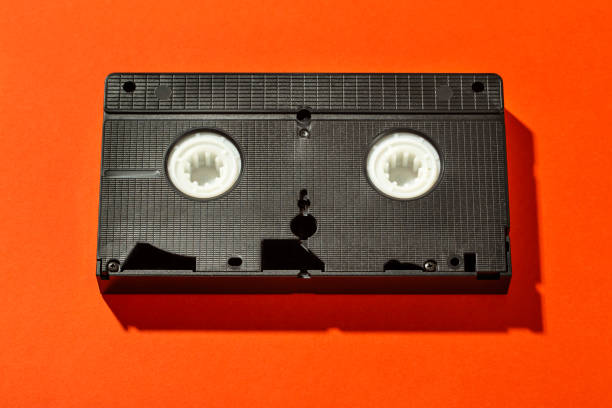 istock An old plastic video cassette for a film VCR against a bright background. 1186752107