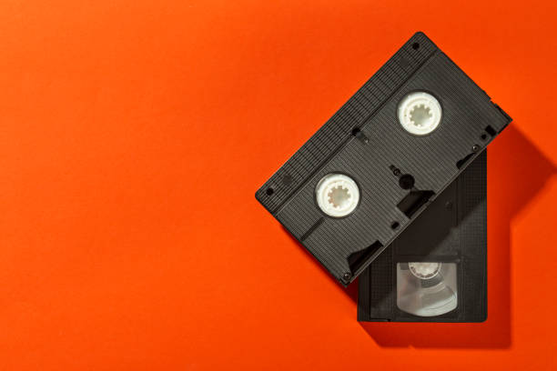 istock An old plastic video cassette for a film VCR against a bright background. 1186752174