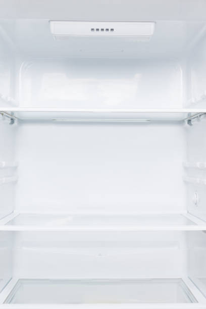 istock open white fridge with shelves, inside view, close-up 1186755648