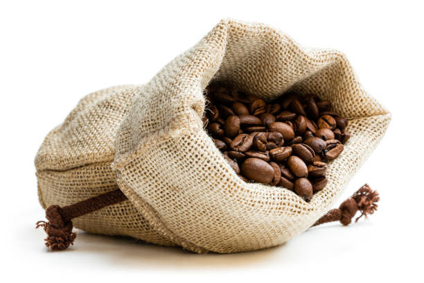 istock Coffee beans in burlap bag isolated on white 1186756179