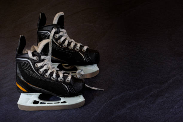 istock Children Hockey skates over dark concrete rustic background with copy space 1186756224