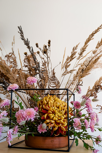 Autumn decoration with flowers and dried plants