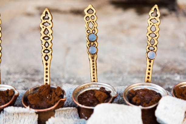 istock Traditional Turkish coffee cooked in hot sand and three copper cezve 1186759502
