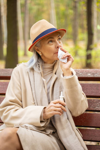 istock Dispirited woman with a paper tissue looking up 1186763335