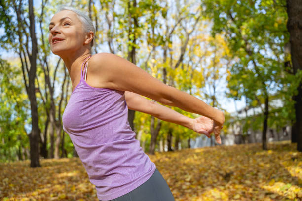istock Athletic lady with her arms behind the back 1186763685