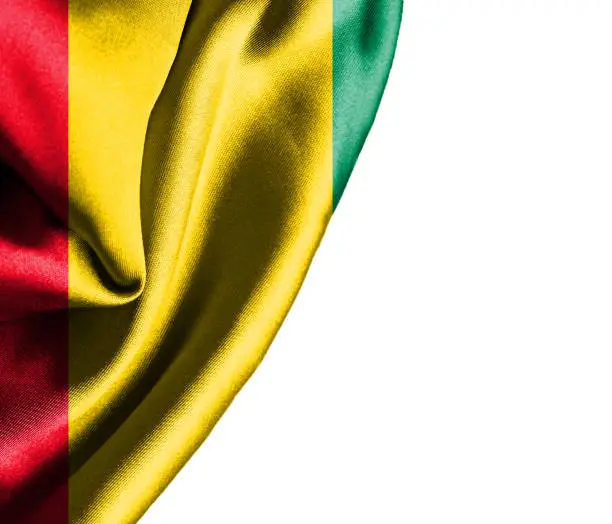 Photo of Guinea waving silky flag isolated on white background