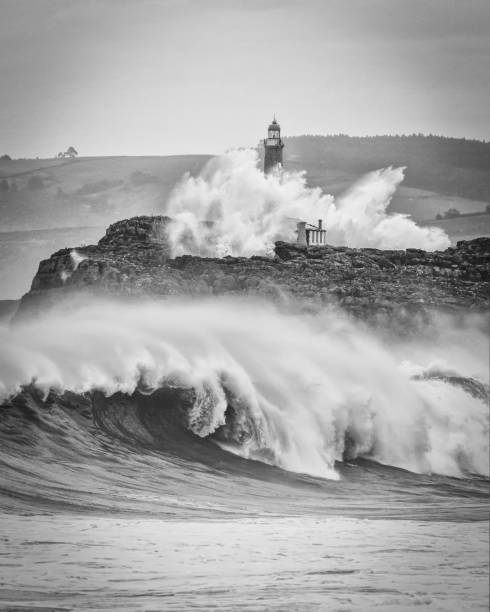 Huge waves splashing at the Mouro island lighthouse