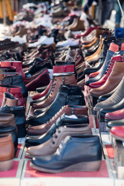 istock Shoes at a weekly market stall 1186766281