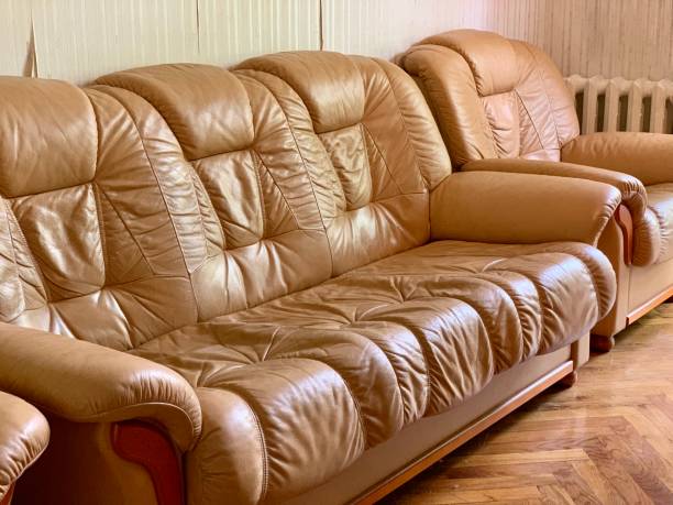istock beautiful leather sofa and armchairs 1186767183