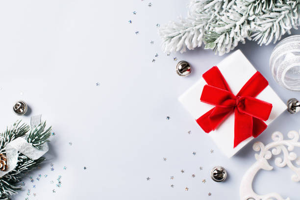 istock Christmas gift box flat lay on white background with decoration. 1186770062