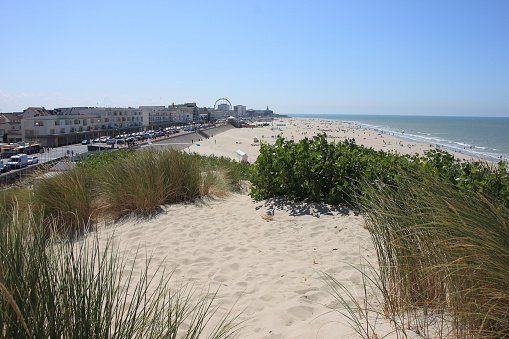 The photograph was taken from the top of the dunes. Beach and town of Berck, France.