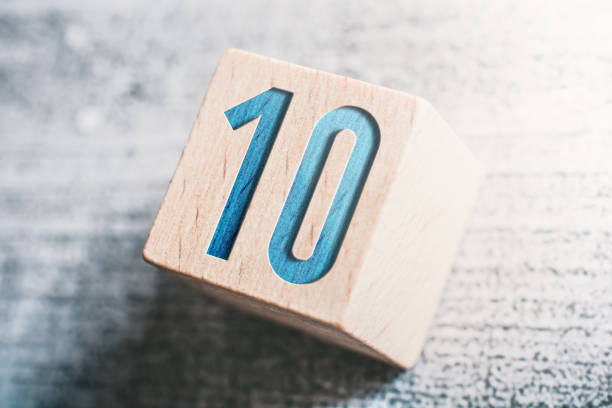 Number 10 On A Wooden Block On A Table stock photo