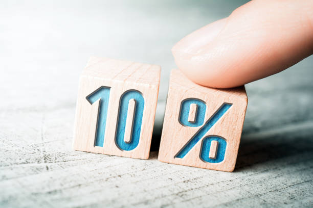 10 Percent Sale Discount Formed By Wooden Blocks And Arranged By A Female Finger On A Table stock photo