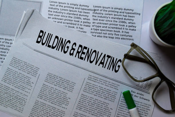 istock Building and Renovating text in headline isolated on white background. Newspaper concept 1186776175