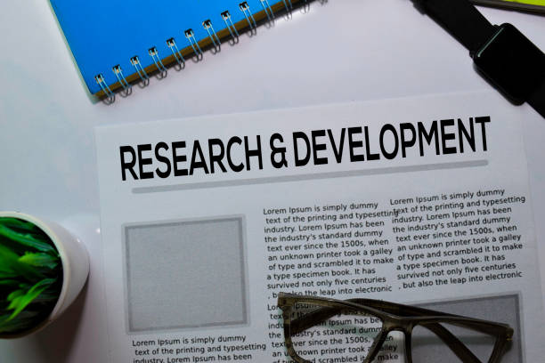 Research and Development text in headline isolated on white background. Newspaper concept