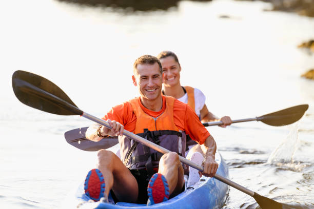 istock Smiling Spanish paddlers approaching in tandem kayak 1186776290