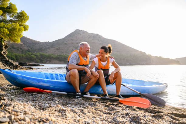 istock Affectionate Spanish friends enjoying kayaking in morning 1186776776