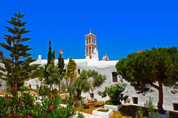 famous panagia tourliani monastery, in the village of ano mera, in the center of mykonos, beautiful cycladic island in the heart of the aegean sea - european culture spirituality traditional culture famous place imagens e fotografias de stock