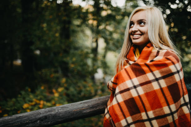 Happy sensual blonde  and smiling in the deep forest