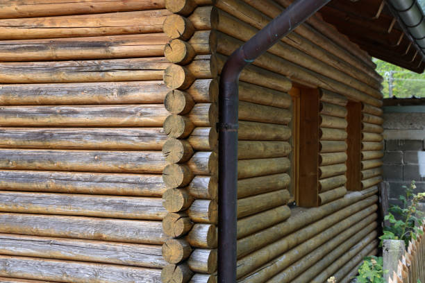 istock Log cabin home - Wall of house from logs 1186786178