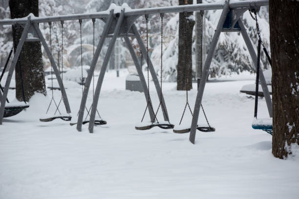 istock playground equipment in a snow covered park 1186789158