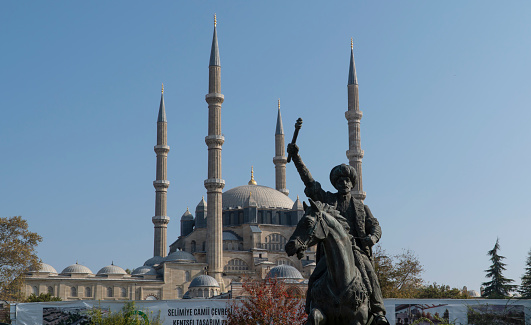 Edirne, Turkey - 26 October, 2019: Fatih Sultan Mehmet (Mehmed the Conqueror) statue with Selimiye Mosque on background in Edirne, Turkey