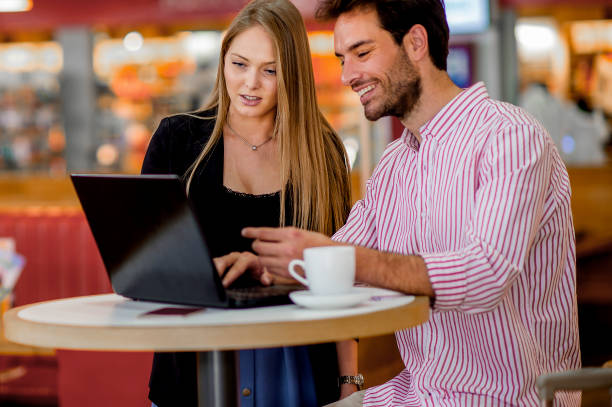 istock Attractive young couple checking airline schedule 1186794691