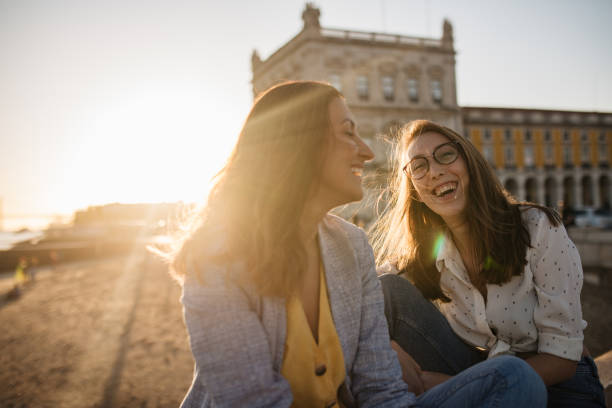 istock Two girlfriends enjoying beautiful Lisbon sunset 1186795639