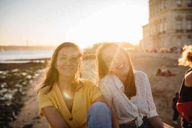 istock Smiling girlfriends enjoying Lisbon sunset 1186796568