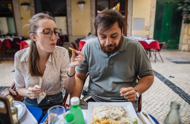 彼の食べ物はいつも私の食べ物の方が良い - portuguese culture women ethnic smiling ストックフォトと画像