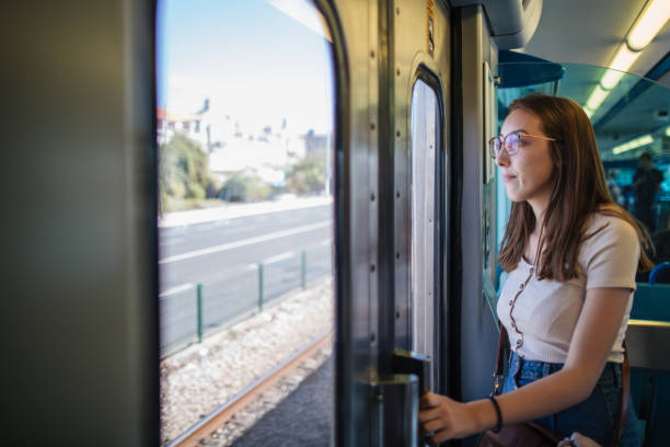 istock Young woman in passenger train 1186796657