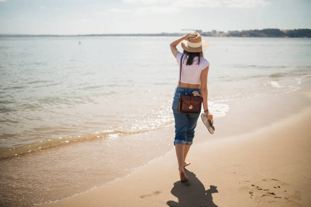 istock Young woman at the beach 1186796728
